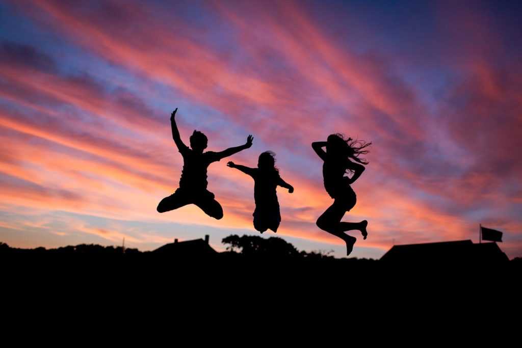confident women jumping in the air